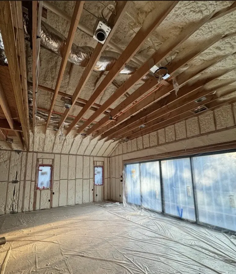 Interior walls and ceiling insulated with spray foam during new construction in Struthers
